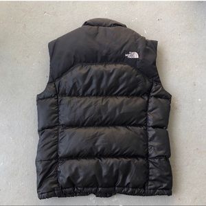 north face puffer vest with hole beside zipper (see photo)
